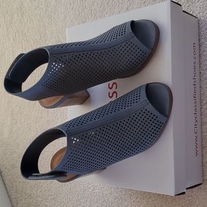 Brand new. Never worn. Size 6 light blue/grey peep toe sandal